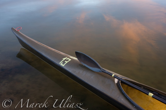 racing kayak, wing paddle, calm lake